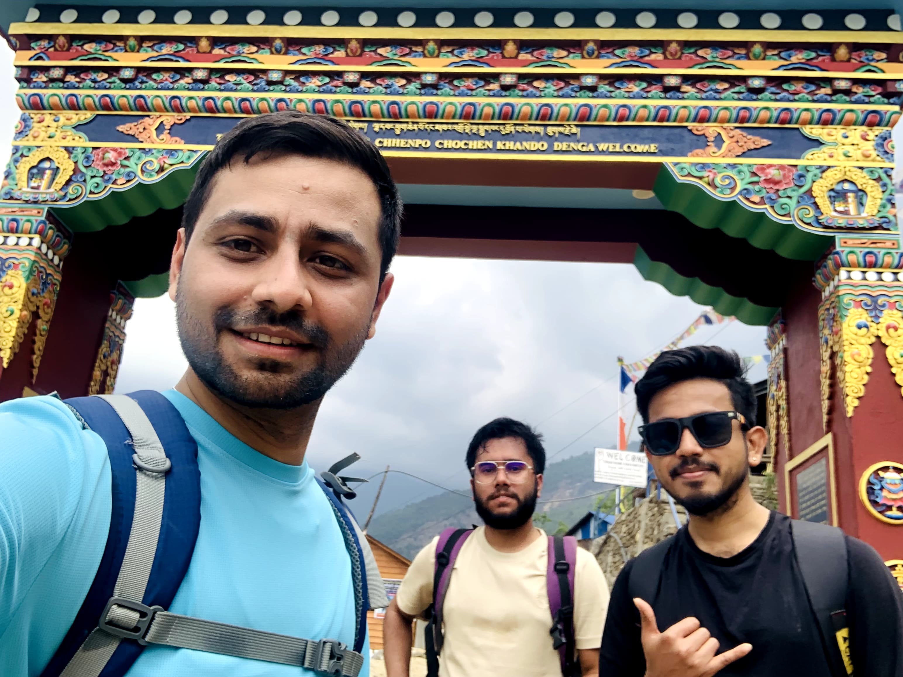 Group selfie at monastery gate