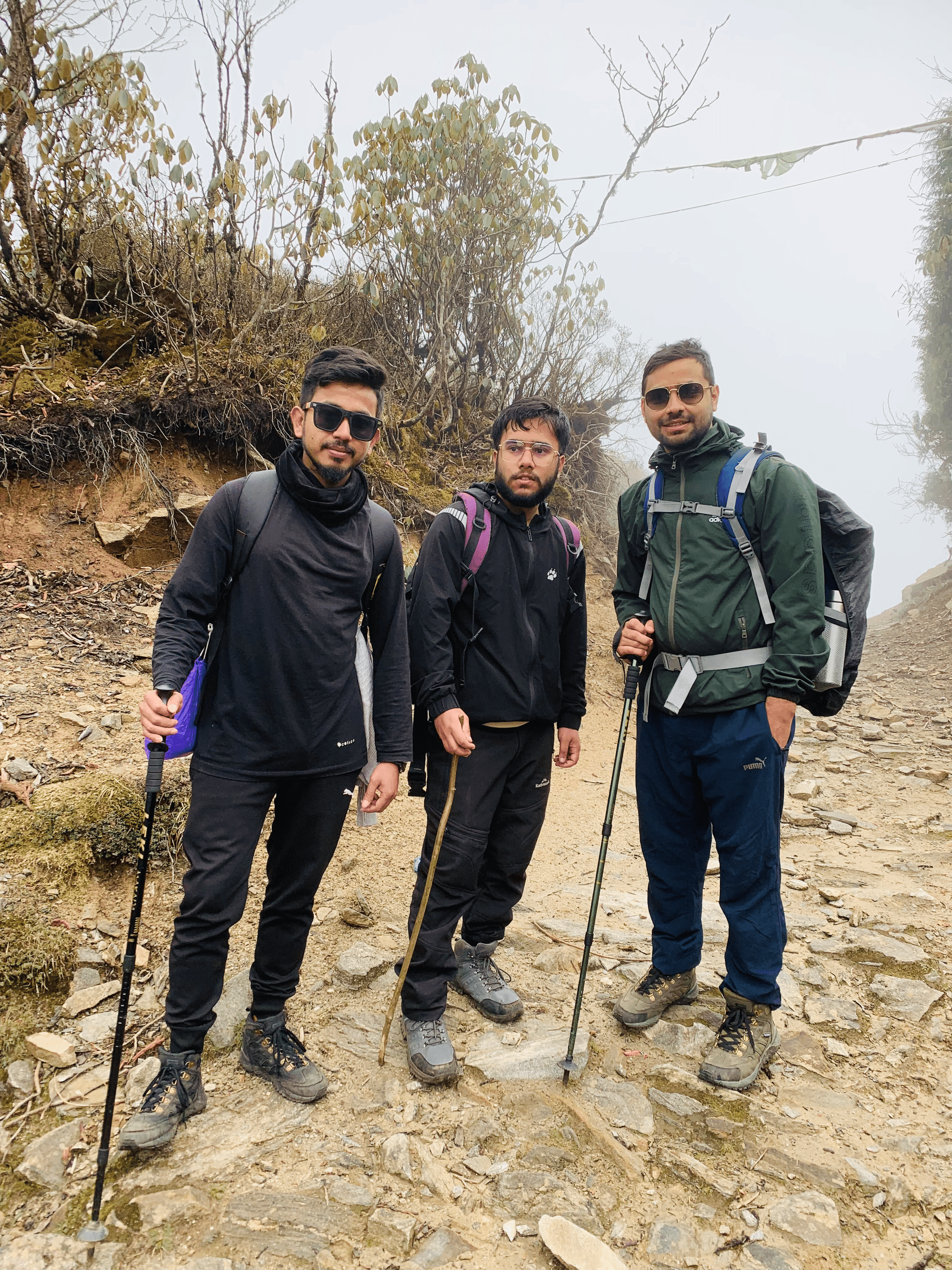 Standing together on the trail with walking sticks