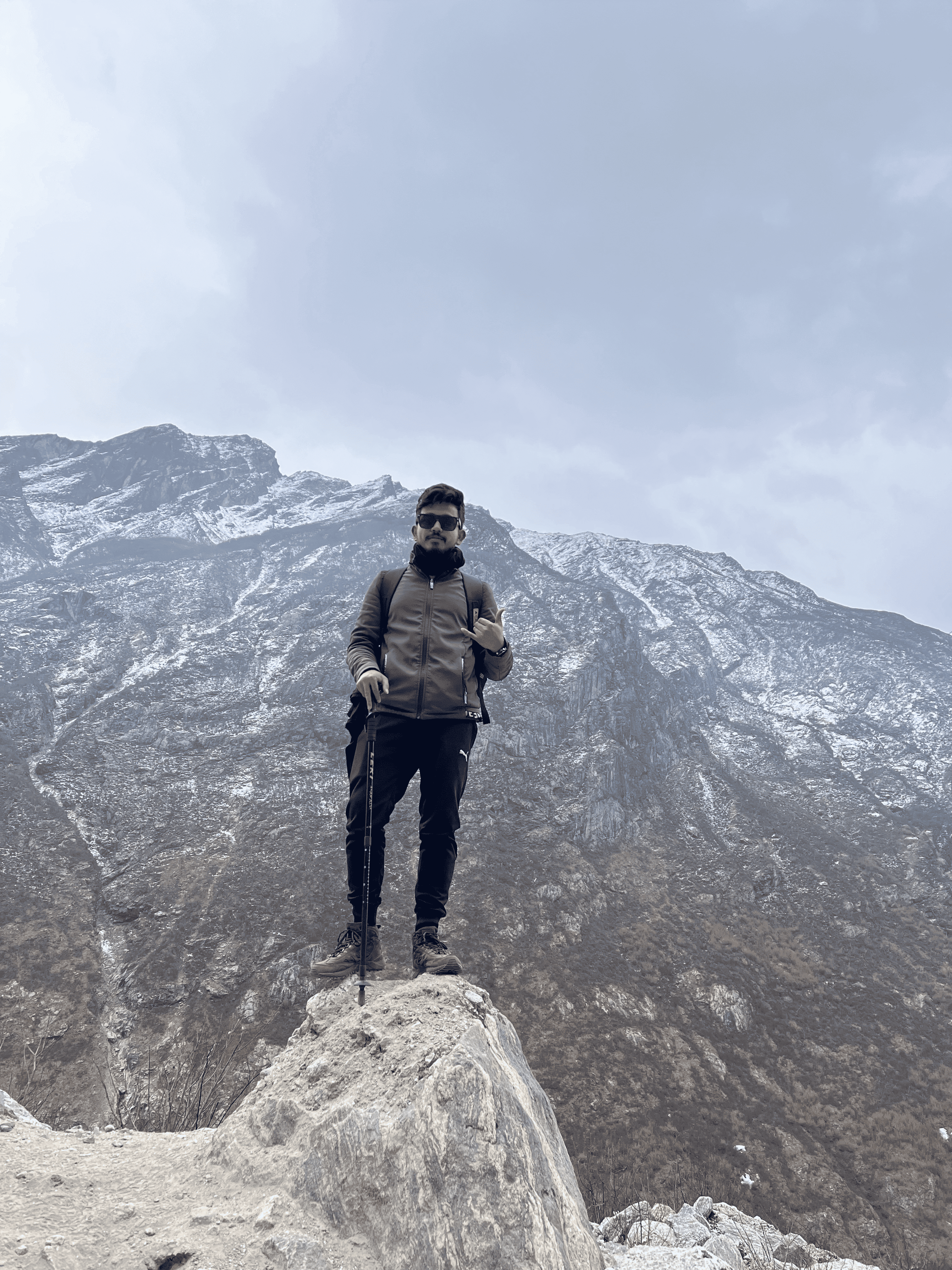 Standing beneath snow-covered Himalayan peaks