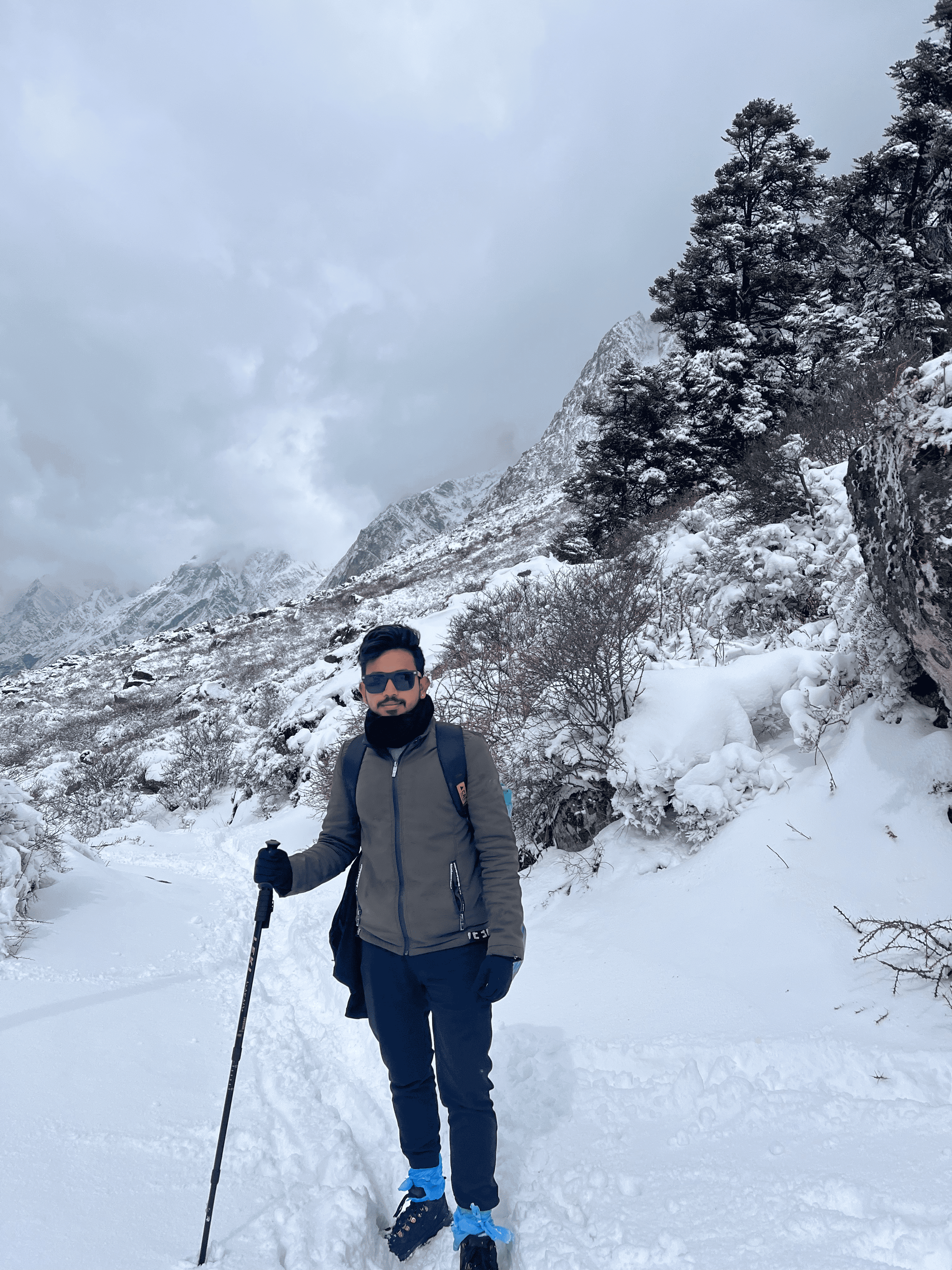 Solo trekker on snow-covered Langtang trail