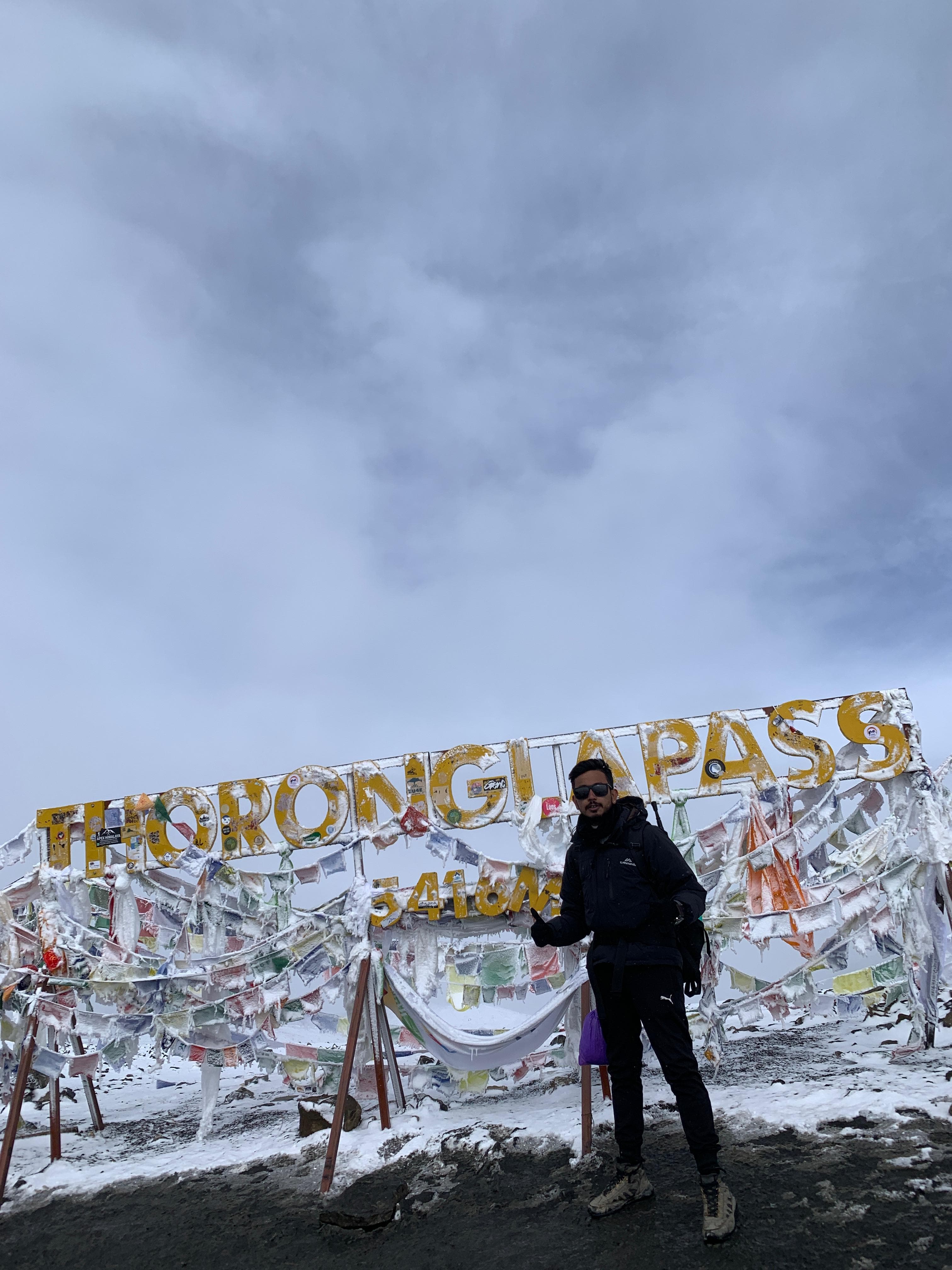Man walking on snowy ridge